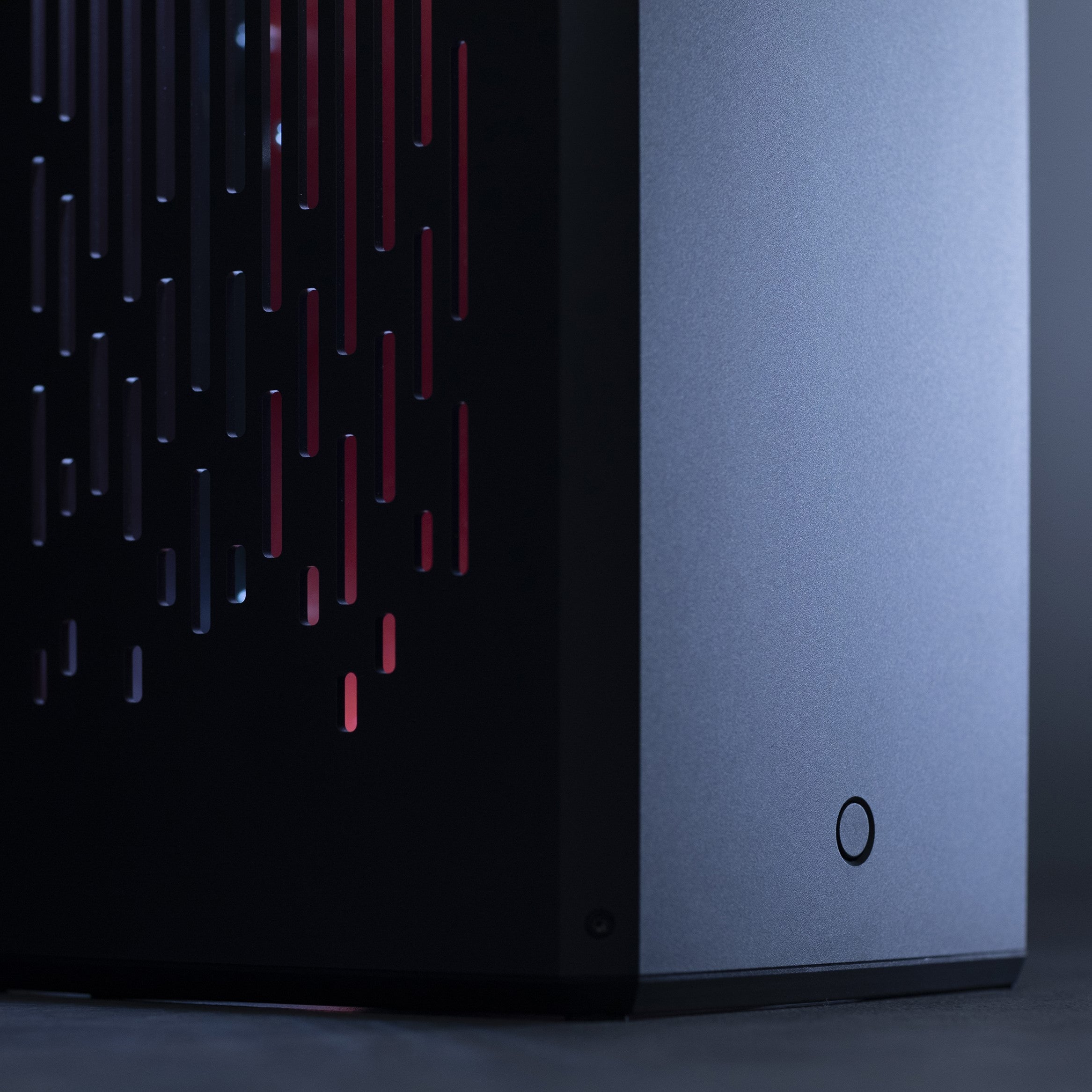 Minimalist gaming desk setup featuring the LOUQE RAW S1 aluminum case